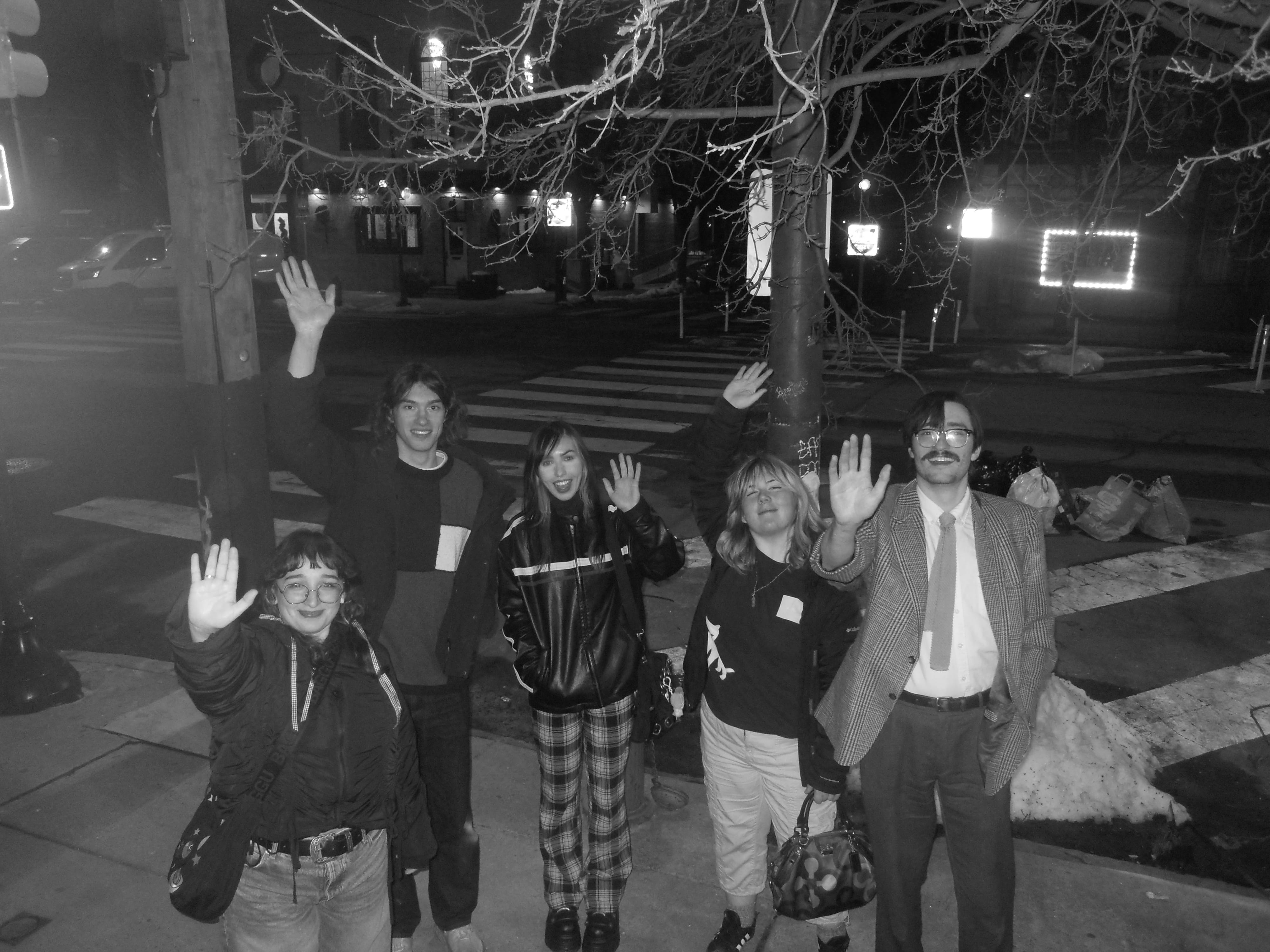 a picture of everyone saying bye to Anna